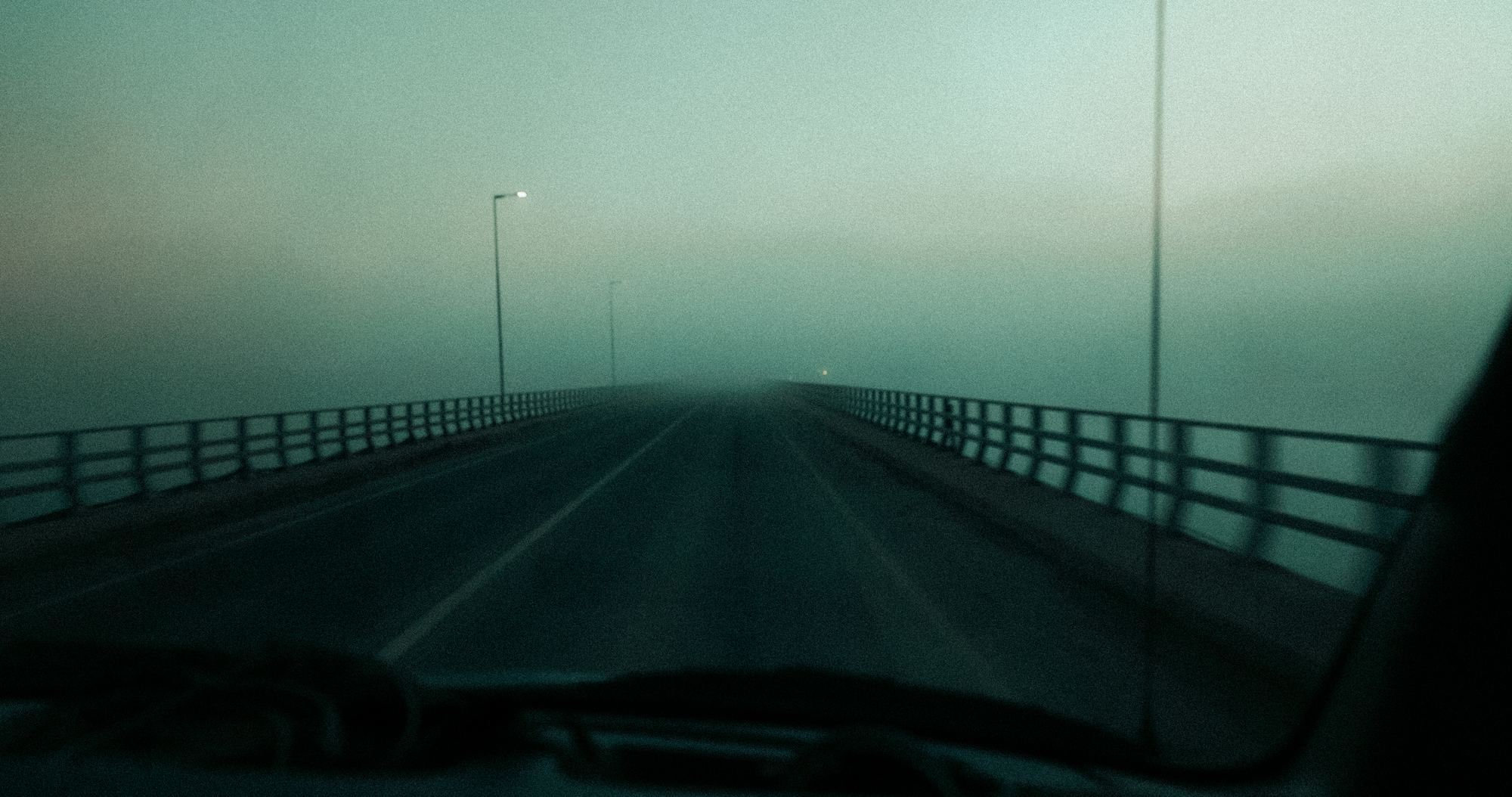 Foggy bridge through car windshield Ireland