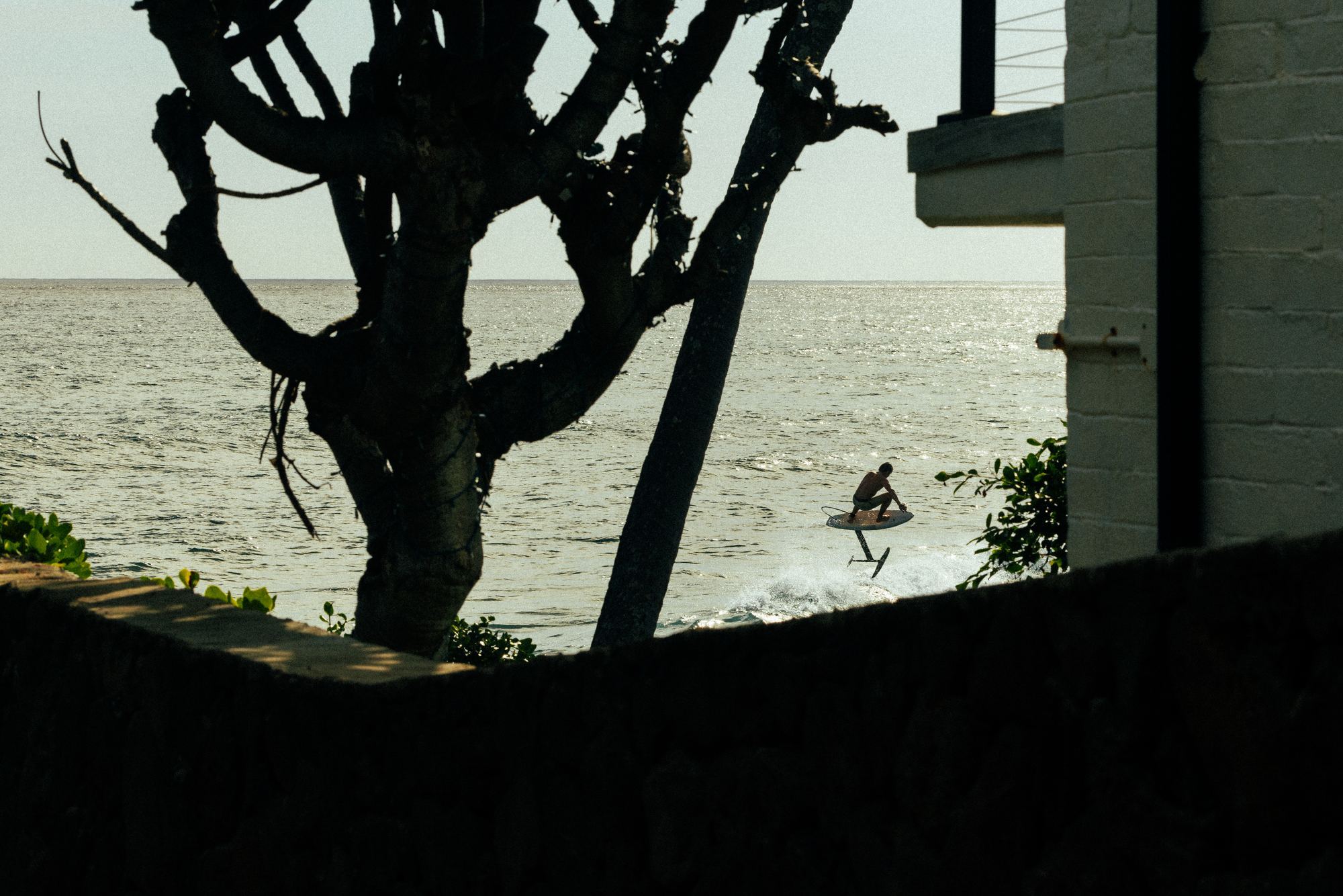Surfer in rain and spray