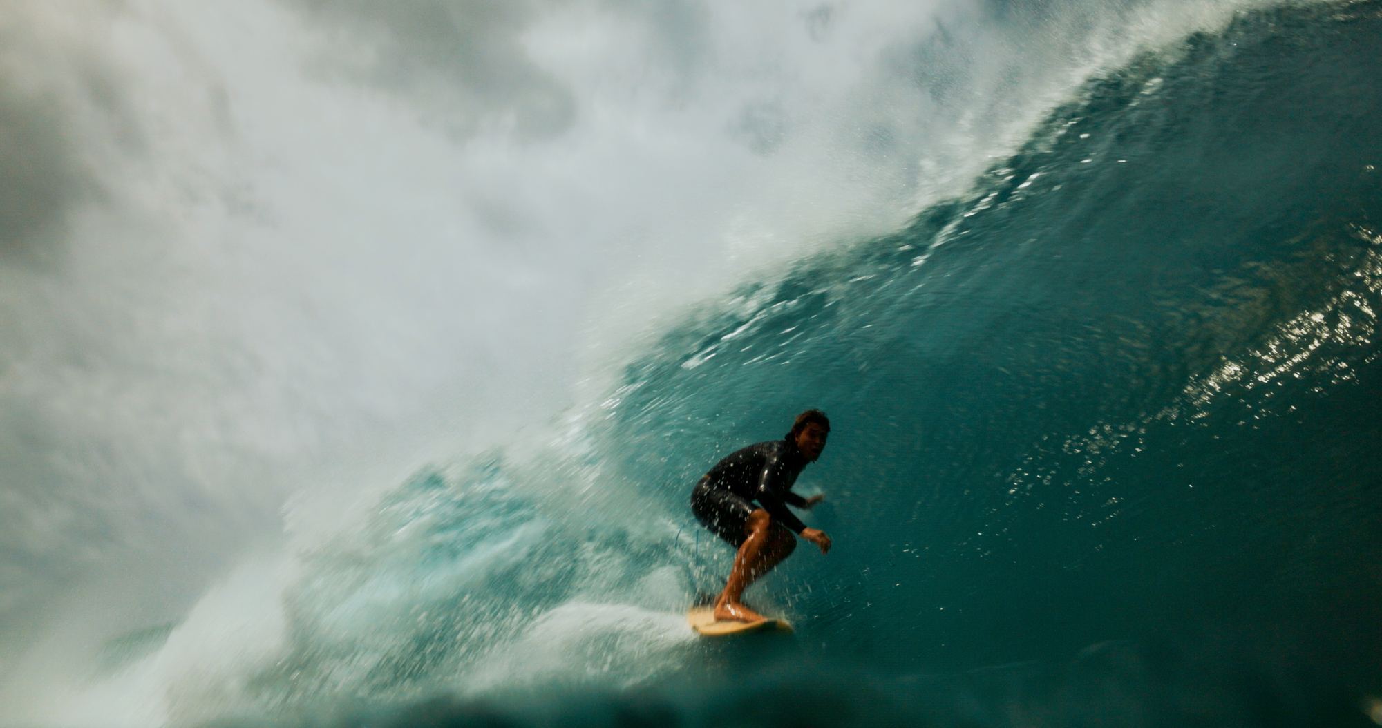 Surfer inside barrel looking out