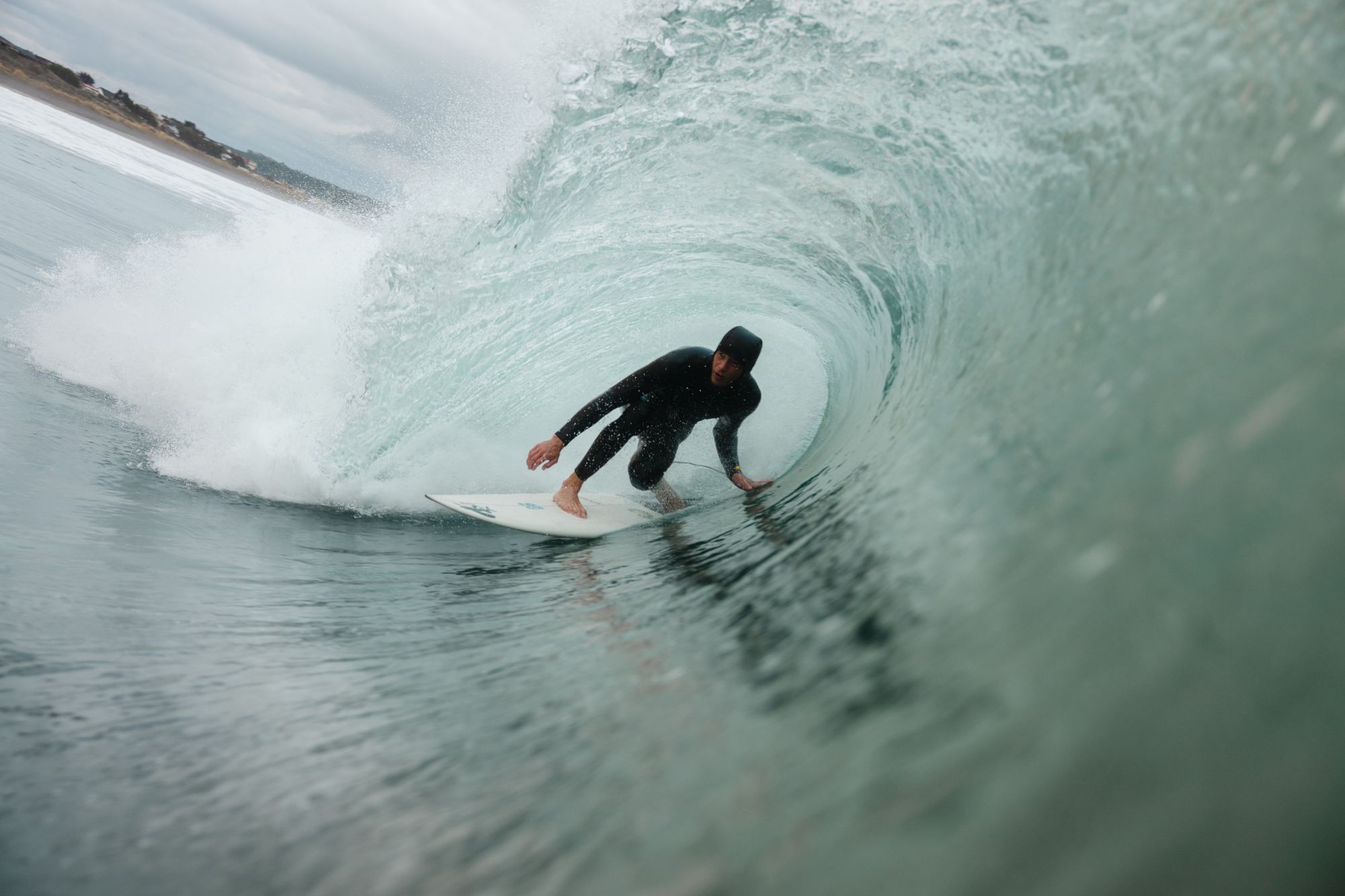 Surfer inside green barrel Ireland